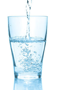 a water filtration system produces a glass of purified water